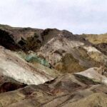Death Valley Artist's Palette panorama — layered ochre, green, and purple volcanic minerals
