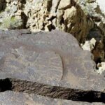 Native American petroglyphs on canyon rock face, Death Valley region